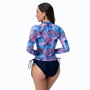 Rear view of long sleeve surfing top with leopard print and side-tie bikini bottom