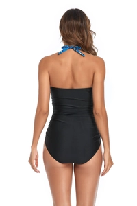 Back view of a sleek black one-piece swimsuit featuring blue patterned halter straps and a slim fit