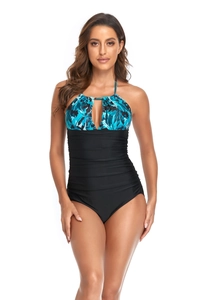 Detail of tummy control swimwear featuring tropical leaf print and keyhole cutout design