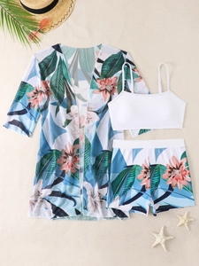 Flat lay of white bikini set with tropical floral print high waist bottom and matching cover-up