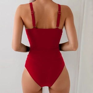 Rear view of red one-piece swimsuit featuring an open back design and thin shoulder straps