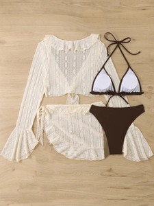 Flat lay detail of brown bikini set with white crochet lace long sleeve cover-up