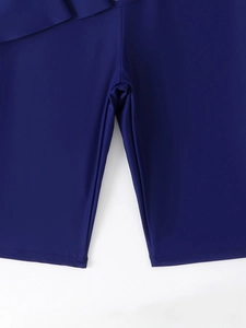 Detail showing the flat stitching and inner crotch construction of navy blue swim shorts