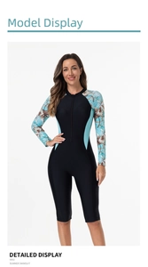 Detail of front zipper and tropical floral print on long sleeve one-piece surfing swimsuit
