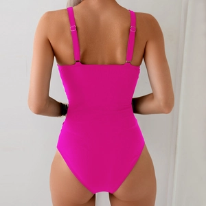 Detail of adjustable straps and open back on a vibrant rose pink one-piece swimsuit