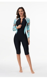 Close-up of long sleeve one-piece swimsuit with floral sleeves and front zipper detail