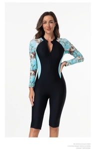 Close-up of front zipper and long sleeves on floral print one-piece surfing swimsuit