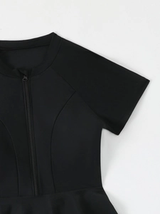 Close-up of black short sleeve swimwear featuring a central zipper and slim fit seams