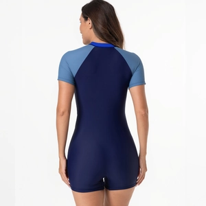 Rear view of short sleeve one piece swimsuit in navy and light blue color block design
