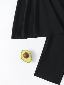 Detail shot of black modest swimwear fabric showing premium texture and smooth hem finish