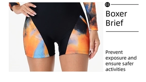 Detail showing boxer brief cut on black one-piece swimsuit with colorful abstract print