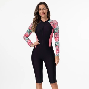 Detailed view of the black and pink long-sleeved floral rash guard with front zipper closure