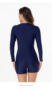 Back view of long-sleeve dark blue surf swimsuit showing snug fit and high-quality fabric