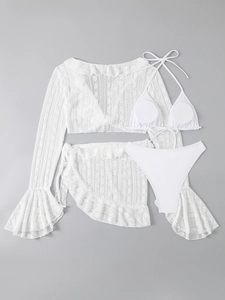 Detailed view of white three-piece swimsuit with long-sleeved lace cover-up and high-waist bottom