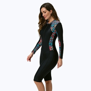 Detail of long sleeve surfboard swimsuit with geometric print and front zipper closure