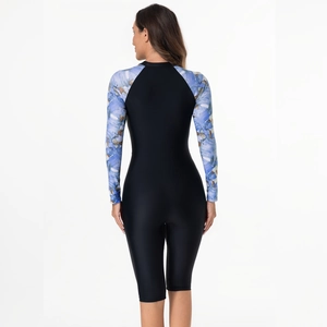 Back view of long sleeve rash guard with black body and floral print sleeves