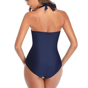 Back view of a deep blue backless one-piece swimsuit with adjustable halter neck ties