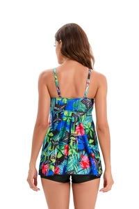 Rear view of floral tankini top with black high-waisted shorts and tropical print