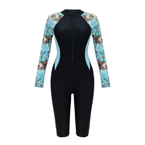 Women's long sleeve one-piece swimsuit with floral print and front zipper closure