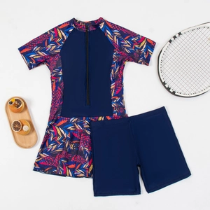 Detail view of navy two-piece short sleeve swimsuit with front zipper and floral print