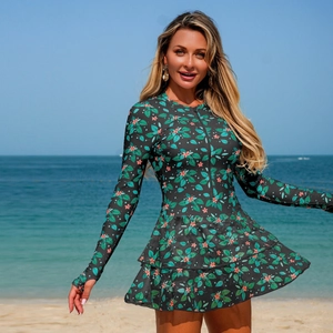 Detail of floral print one-piece swim dress with long sleeves and front zipper closure