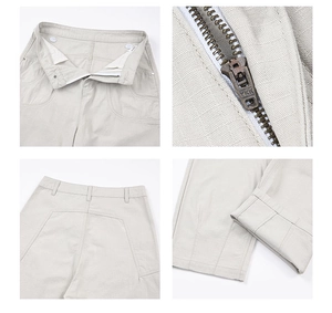 Détails du pantalon cargo gris clair avec fermeture éclair YKK, boutons et coutures