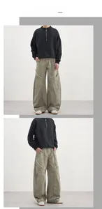 Détail du pantalon cargo kaki avec coutures courbées et accents usés aux genoux