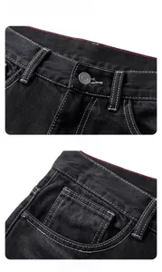 Détails du denim noir délavé avec surpiqûres contrastées et bouton en métal robuste