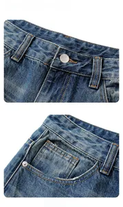 Dettaglio di jeans vintage larghi con bottoni in metallo e rivetti sulle tasche