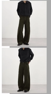 Deep green vintage corduroy wide-leg pants showing texture and relaxed fit style