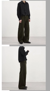 Detailed side view of vintage wide-leg corduroy pants showing draped fit and soft texture