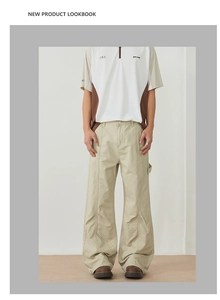 Detail shot of men's apricot casual flared cargo pants paired with a zip polo shirt
