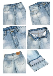 Détails du jean bleu délavé avec boutons métalliques et patch en cuir à la taille
