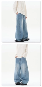 Détail de ce jean bleu clair surdimensionné avec coutures latérales et coupe ample chic