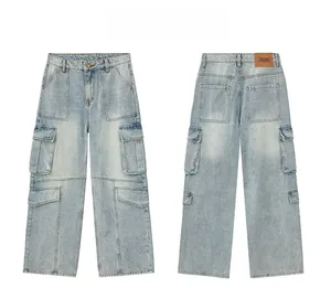 Detail view of washed denim texture and brown leather jeans label on blue cargo pants