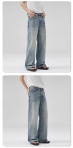 Detailed macro view of retro washed blue denim texture and high-waisted wide leg cut