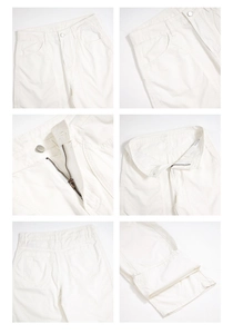 Detail view of mercerized cotton pants showing metal zipper, buttons and reinforced stitching