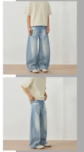 Vues de face et de profil d'un jean large délavé avec effet moustaches de style rétro