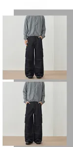 Detailed view of dark blue wide-leg cargo jeans with distinctive large side pockets
