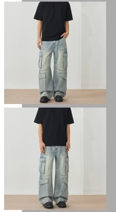 Detail view of light blue cargo jeans with multiple pockets and wide-leg straight cut