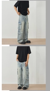 Detail view of light blue cargo jeans with multiple oversized pockets and relaxed fit