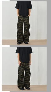 Detail of men's camouflage cargo pants featuring multi-pockets and streetwear ribbon design