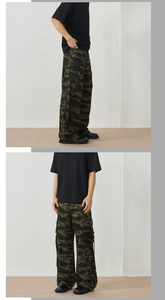 Detail view of deep green camo cargo pants with side pockets and black buckle straps