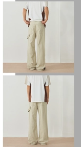 Detail view of khaki cotton cargo pants with side tool loop and back pockets