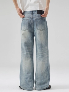Relaxed fit light blue washed denim jeans with vintage faded effect and back pocket detail