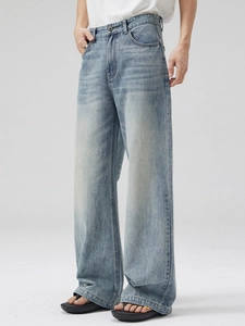 Classic light blue washed wide-leg straight denim jeans with vintage whiskering detail
