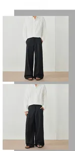 Vue de face et de profil du pantalon large noir pour homme avec drapé élégant