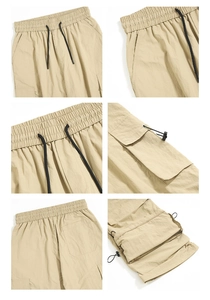 Detail view of khaki cargo pants showing elastic waist, side pockets, and adjustable hems