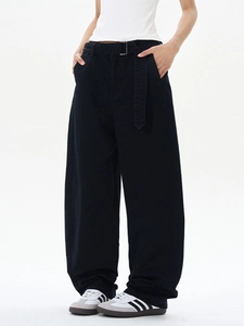 Minimalist black wide-leg trousers with high waist and matching fabric belt and buckle