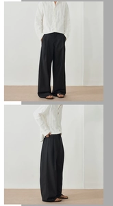 Vue détaillée du pantalon noir large pour hommes et de la chemise blanche texturée chic